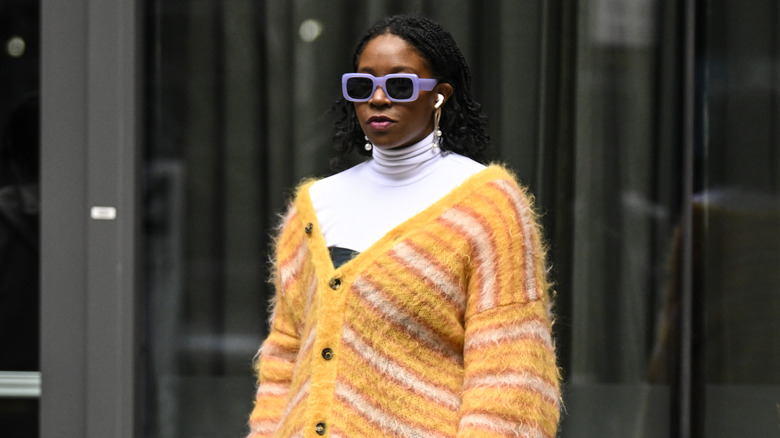 A woman in a yellow sweater