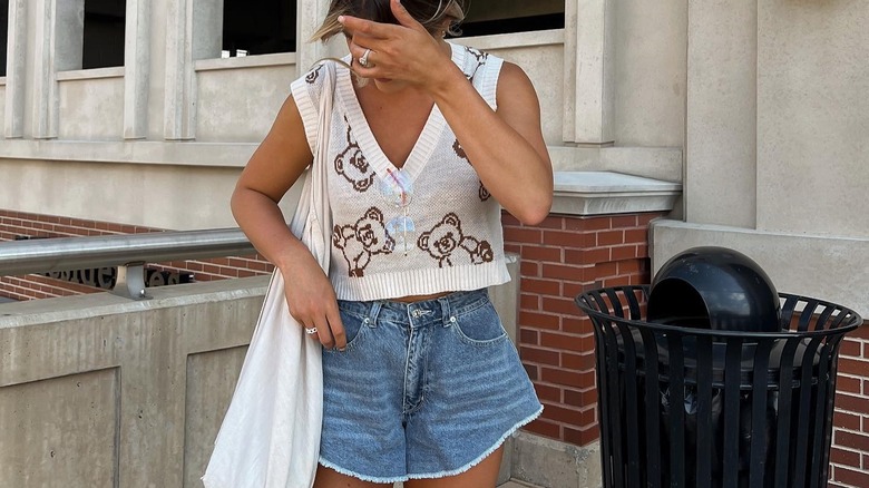 woman in cropped sweater vest