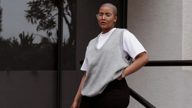 woman in gray sweater vest