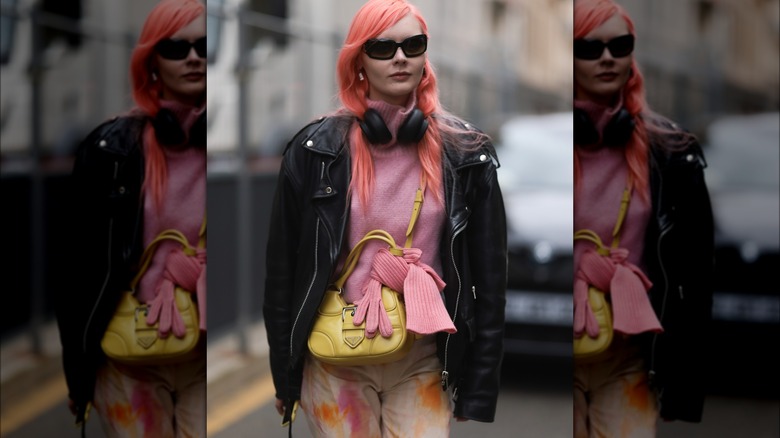 Pink sweater and leather jacket