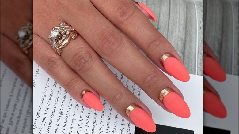 coral and gold reverse french manicure