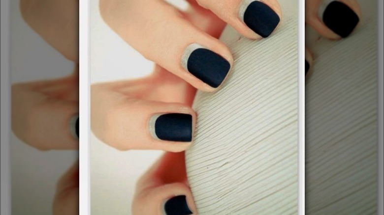 matte black reverse french manicure