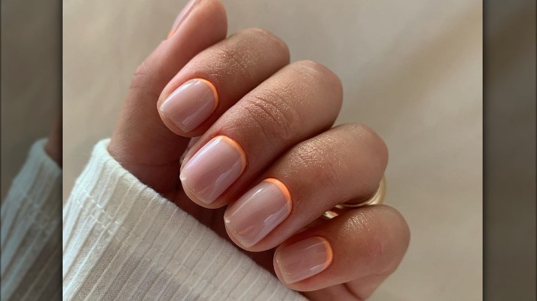 orange reverse french manicure