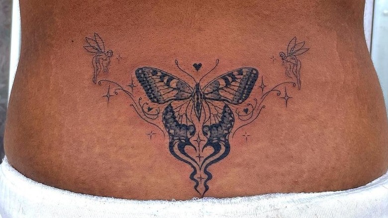 butterfly lower back tattoo