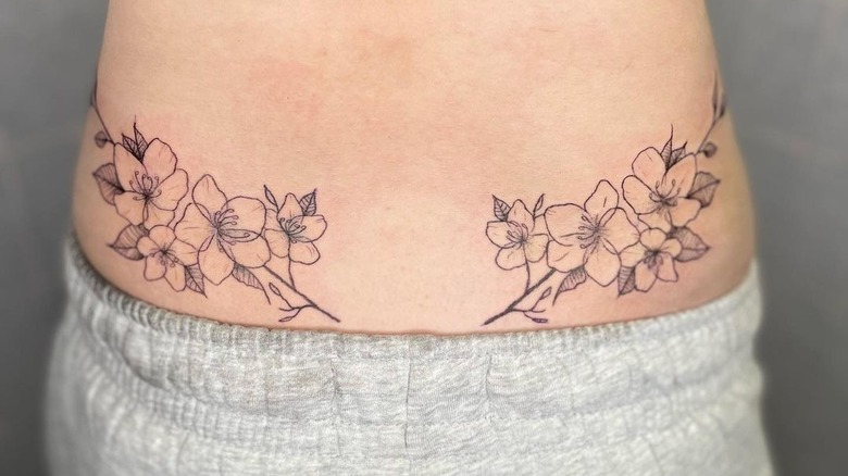 flower lower back tattoo