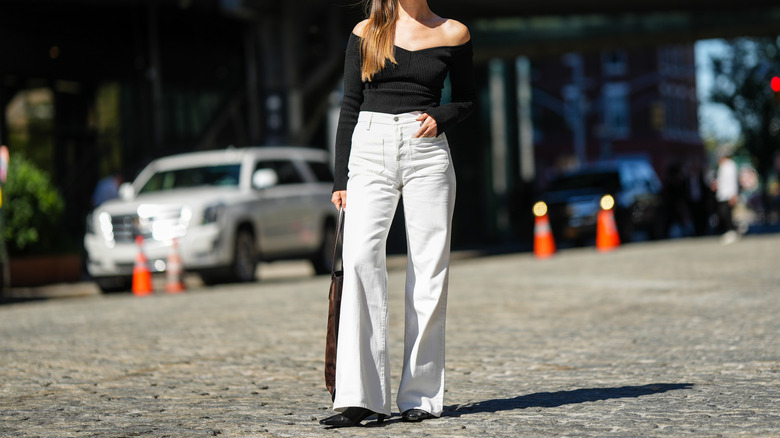 woman wearing white denim jeans
