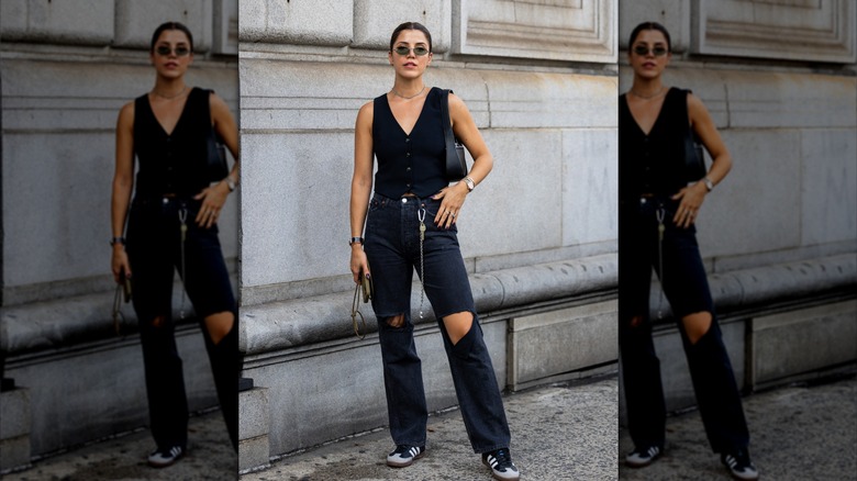 woman wearing vest and jeans