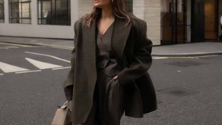 woman wearing brown vest