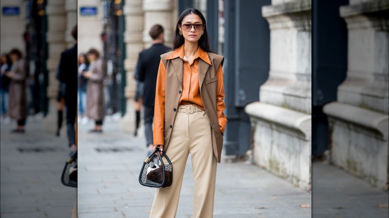 woman wearing long vest