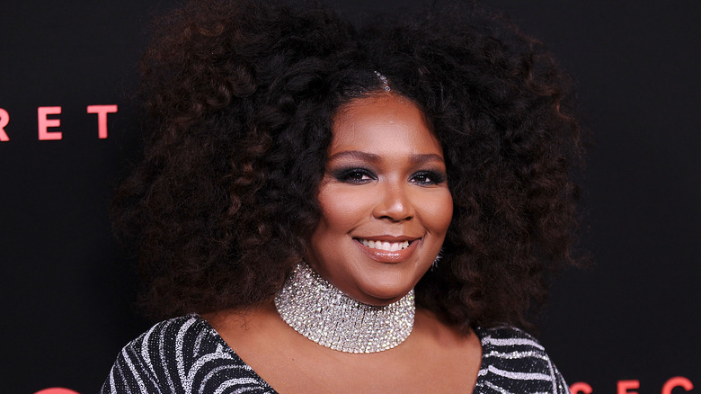 Lizzo in black and white dress