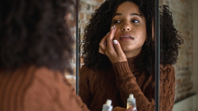 Woman applying gel moisturizer