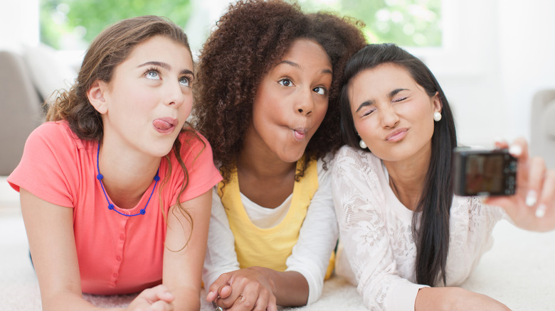 Three girls taking a silly selfie