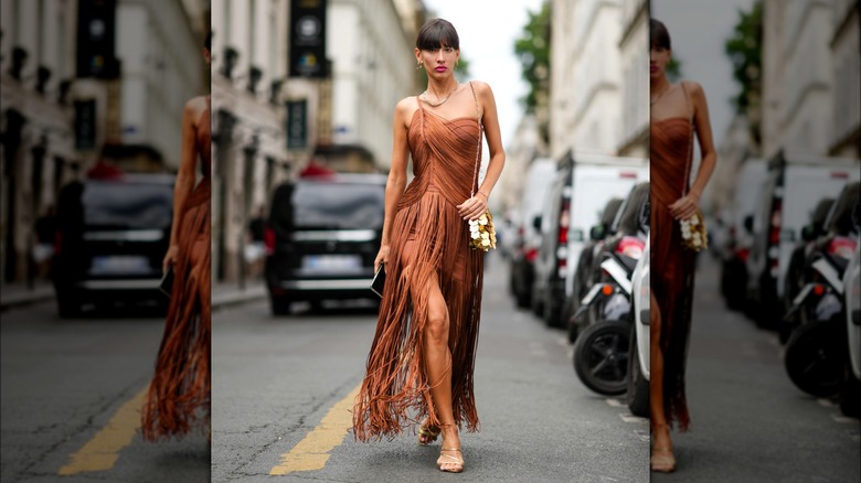 Katya Tolstova wearing fringed gown