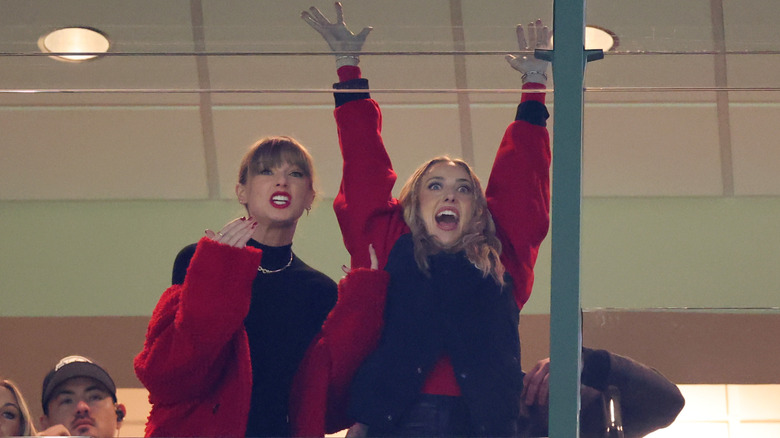 Taylor Swift and Brittany Mahomes cheering during a Kansas City Chiefs game.