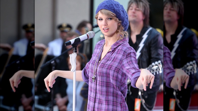 Taylor Swift in a purple beanie