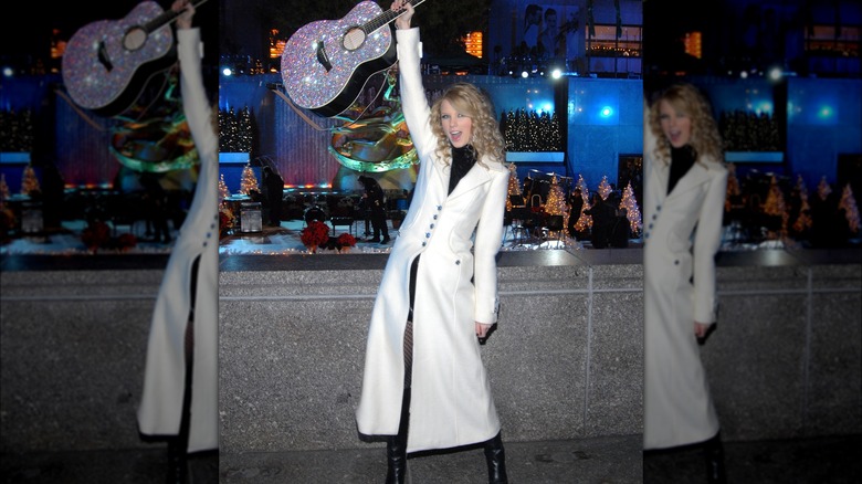 Taylor Swift in a white coat