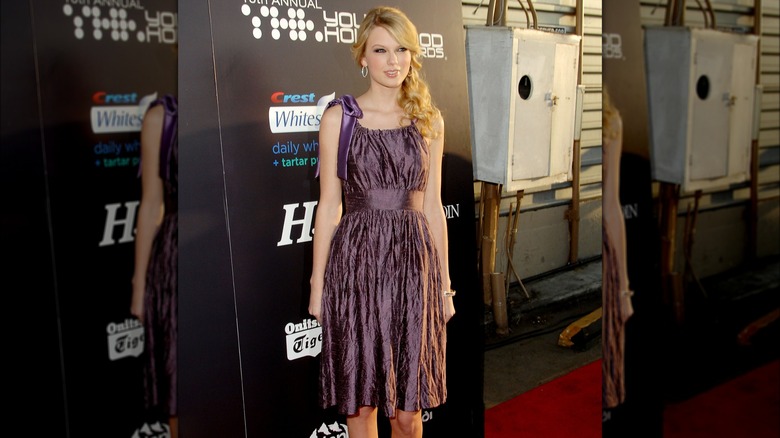 Taylor Swift in a muted purple dress