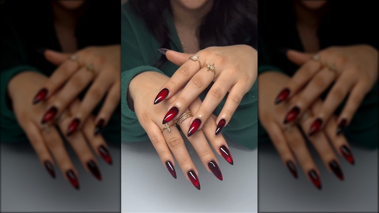 Red manicure with dark edges