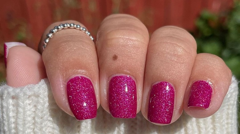 Bright glittery pink square-cut manicure