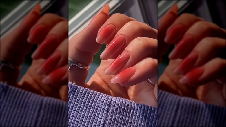 Long rounded aurora red nails