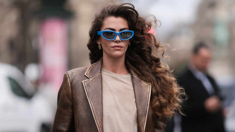 Woman with curly brown balayage