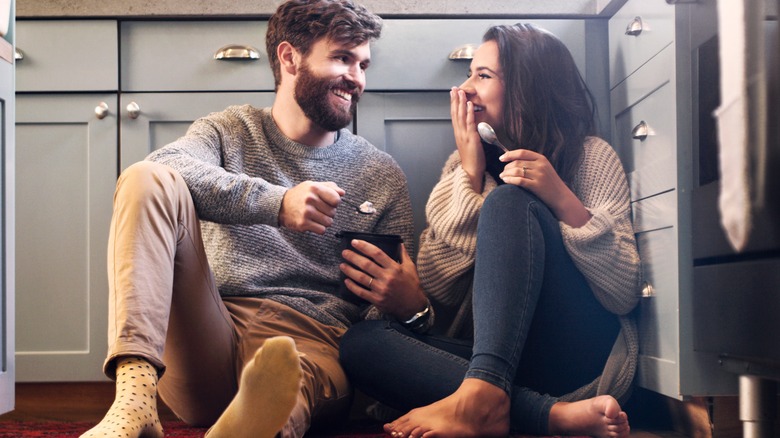 couple on floor laughing