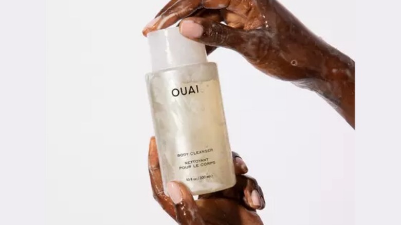 Ouai bottle being held 