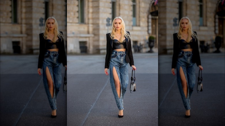 woman wearing bustier top and jeans