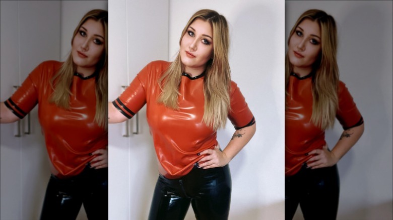 woman wearing orange latex t-shirt