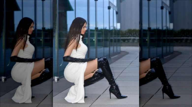 woman wearing black latex boots
