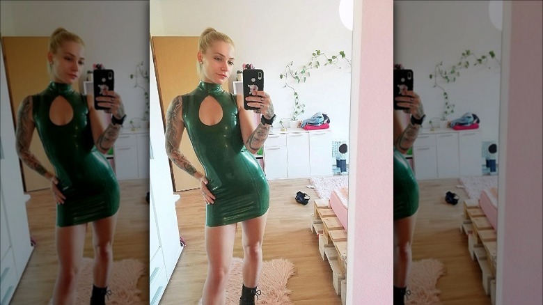 woman wearing green latex dress