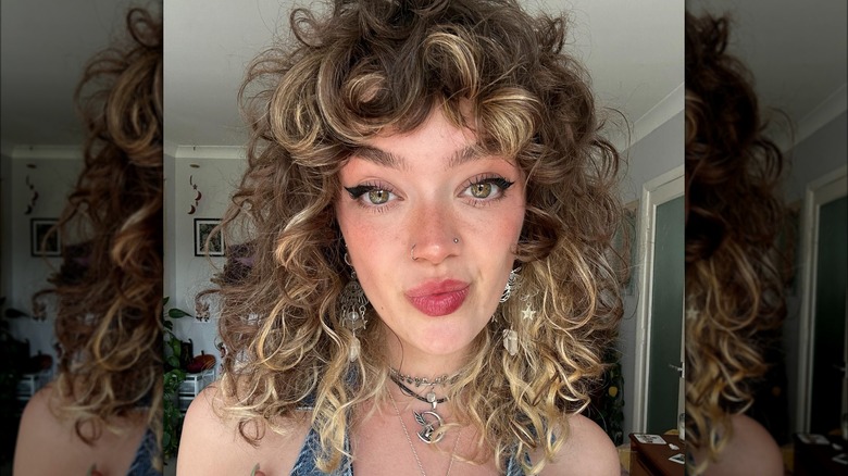 woman with curly bangs haircut