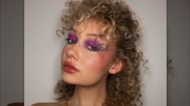 woman with '80s curly bangs