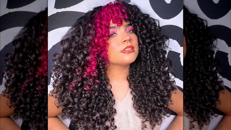 woman with pink curly bangs