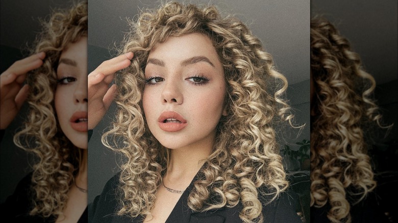 woman with long curly bangs