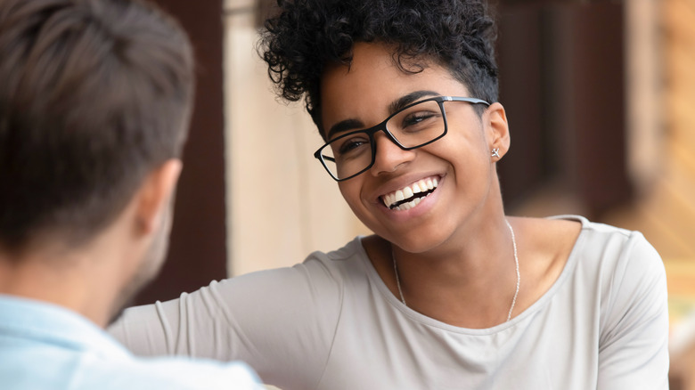 Woman laughing on a date