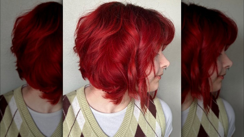 Woman with bright red stacked bob