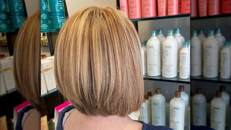 Woman with 90s highlights in stacked bob