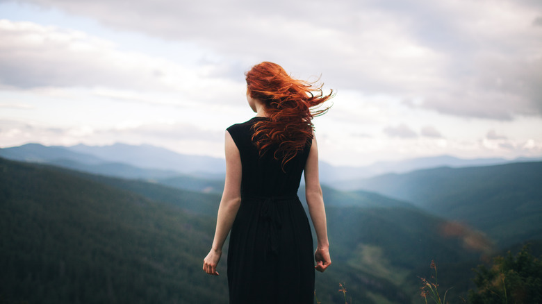 Woman with red hair wind