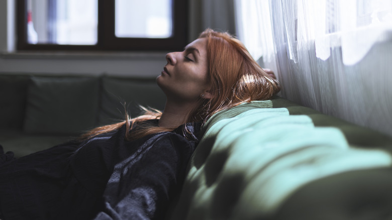 Depressed woman with red hair