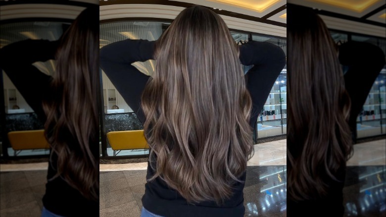 Woman models brunette balayage 