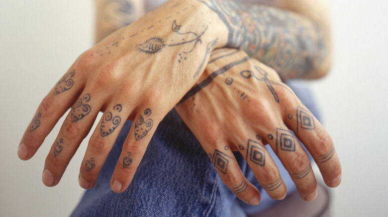 Numerous hand tattoos