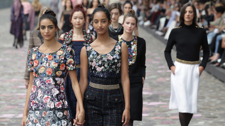 Chanel models walking runway