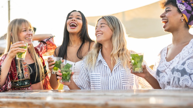 Women drinking on the beach 