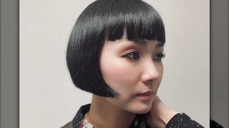 Woman with straight bob and bangs