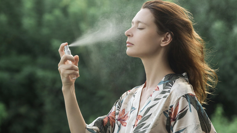 woman using a facial spray