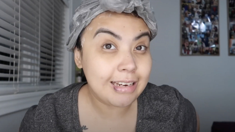 Woman wearing plastic shower cap