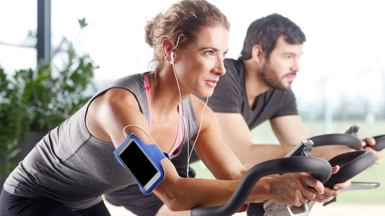 woman on bike with headphones