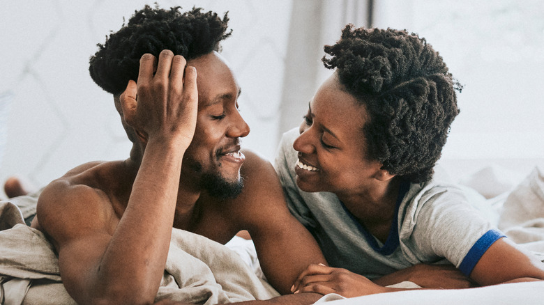 happy couple in bed