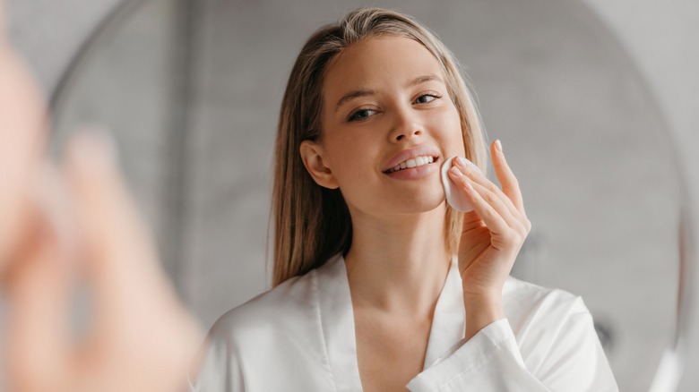 woman smiling in mirror